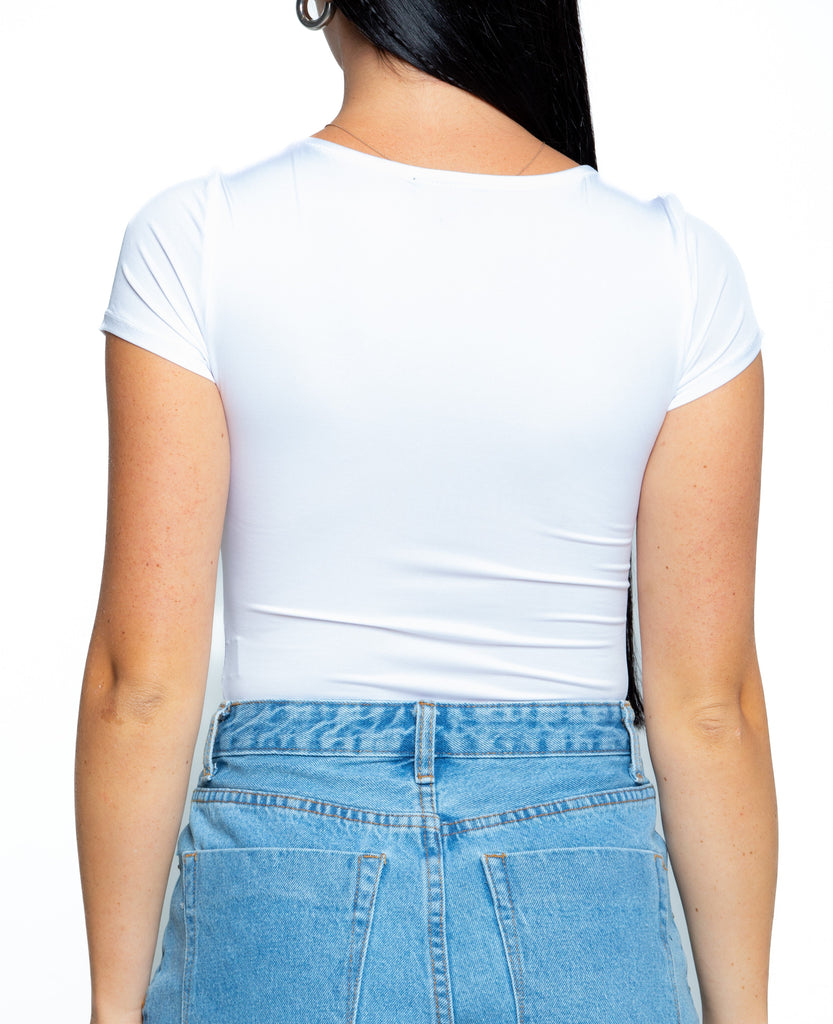 A fashionable women white t-skirt and denim jeans